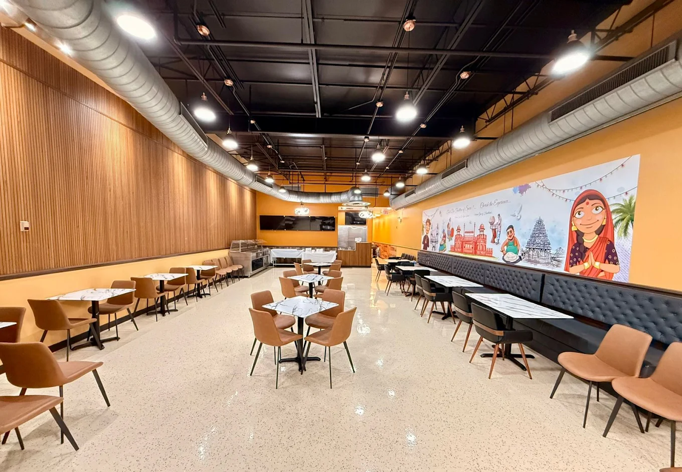 Curry NaanStop dining room with banquette and mural wall
